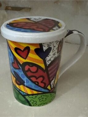 Romero Britto porcelain heart motif mug with lid